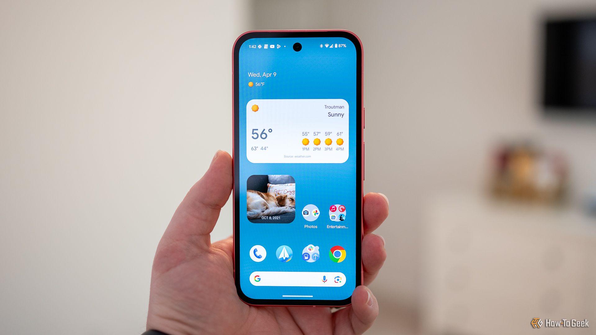 person-holding-the-google-pixel-9a-showing-the-home-screen.jpg